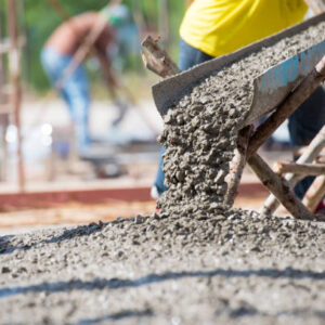 Concrete pouring during commercial concreting floors of building